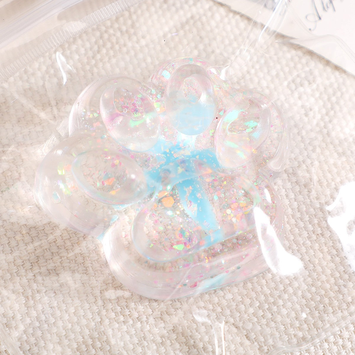 Jucarie Antistres Squishy, Flippy, cu Revenire Lenta, Squeeze Pinch Family, Model Cat Paw, 6.5 x 7 cm, din Tpr, 4-6 Ani, Model 2 Flori, Transparent