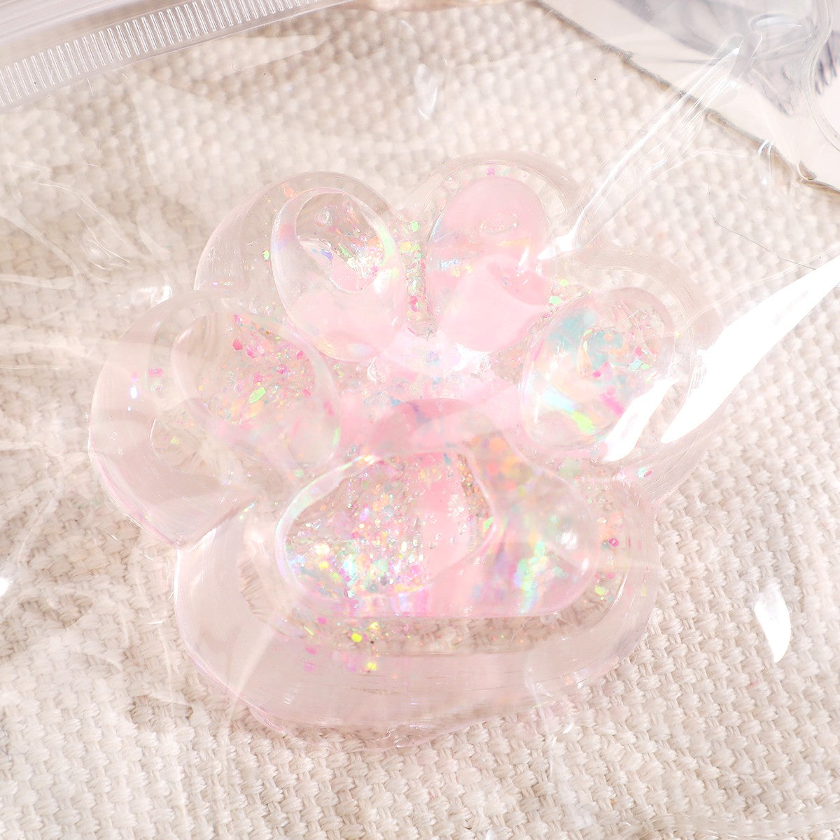 Jucarie Antistres Squishy, Flippy, cu Revenire Lenta, Squeeze Pinch Family, Model Cat Paw, 6.5 x 7 cm, din Tpr, 4-6 Ani, Model 2 Flori, Transparent