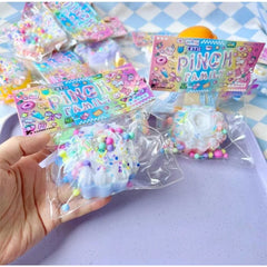 Jucarie Antistres Squishy, Flippy, cu Revenire Lenta, Squeeze Pinch Family, Model Prajitura, 8x8 cm, 90g, Ambalaj Transparent, Multicolor